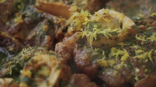 Delicious veal shanks braised with vegetables in frying pan