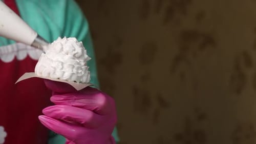 Woman Makes Marshmallow Cones. Using A Pastry Bag. Close Up Shot.