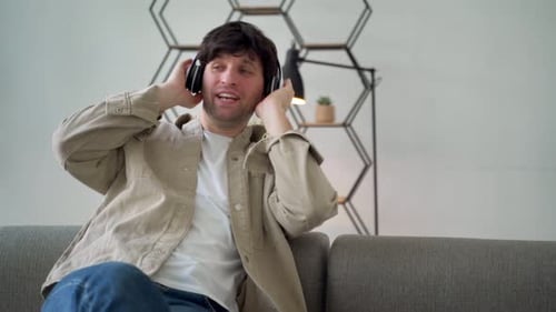 Young Man Listening to Music on Headphones