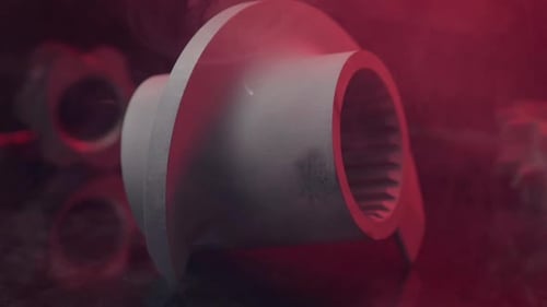 Gray Industrial Machine Part Close Up with Red Lighting