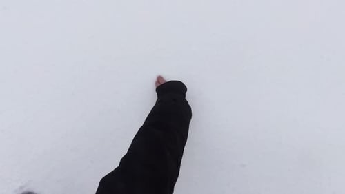 Finger Drawing Heart in Winter Snow