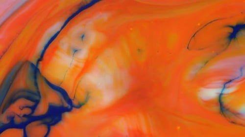 Moving Background Consisting of Blue Yellow Red and Green Particles of the Current Paint on a White