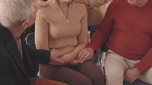 Woman Receives Support from Group of Caring Friends