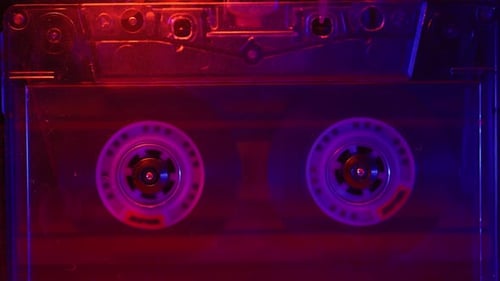 Rotating Cassette Tape in Red and Purple Lights