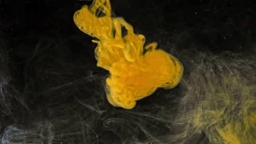 Abstract Golden Paint Flowing in Dark Void