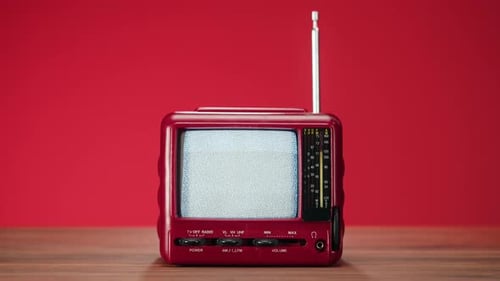 Retro Style Red Television With Antenna on Table