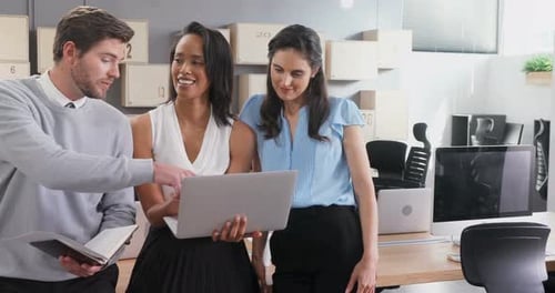Business colleagues discussing over laptop 4k