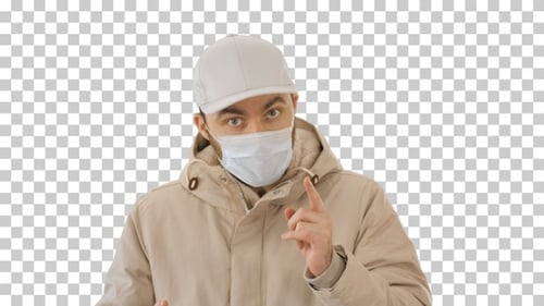 Man in Mask Talking With Hand Gestures