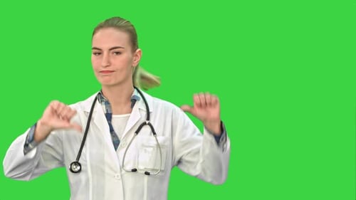 Young Female Doctor Showing Thumbs Down Sign on a Green Screen, Chroma Key
