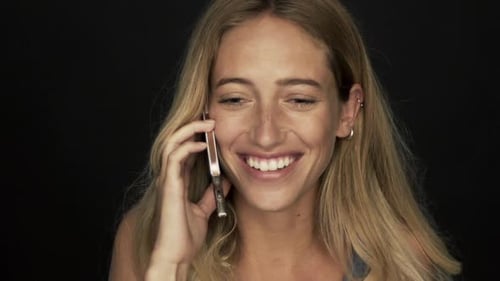 Smiling Woman Talking on Cell Phone Close Up