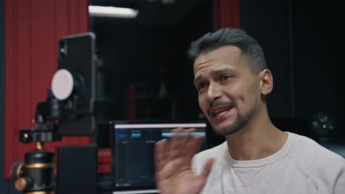 Caucasian Man Broadcasts Live Through a Smartphone on a Social Network