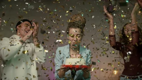 Young Adults Celebrate Birthday with Confetti