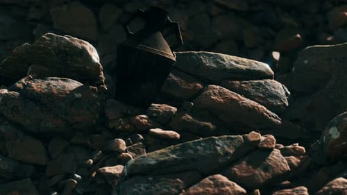 Old Metal Jug at Rocks