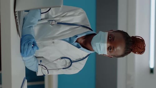 Healthcare Worker Wearing Surgical Mask and Gloves