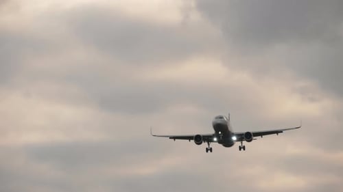 Airliner on Final Approach. View From the Runway's Edge
