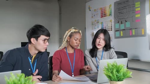 Businessman creative designers present work to the team.Designers a meeting in a modern office.