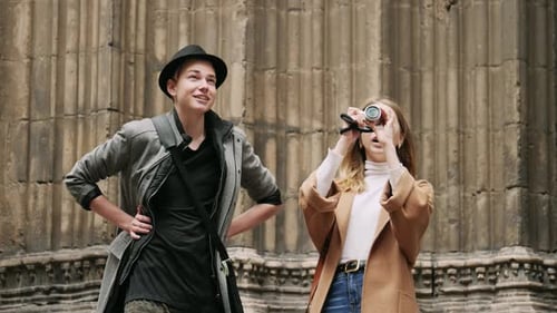 Young Tourists Visiting Old City Landmark