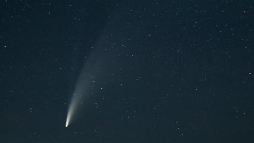 Comet Shines Brightly in Starry Night Sky