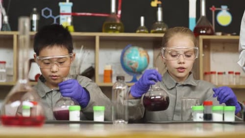 Children Conduct Science Experiment in Laboratory