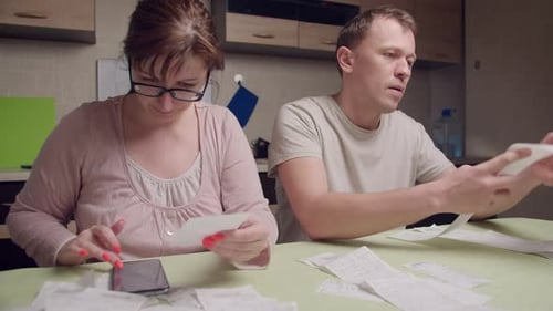 A Married Couple Is Counting Expenses on Checks a Man Is Shocked