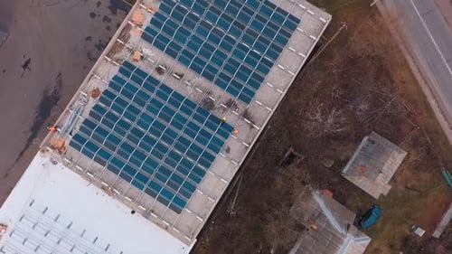 Construction of modern solar farm on roof