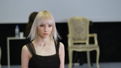 Girl with White Albino Hair Moving on Runway Catwalk Podium