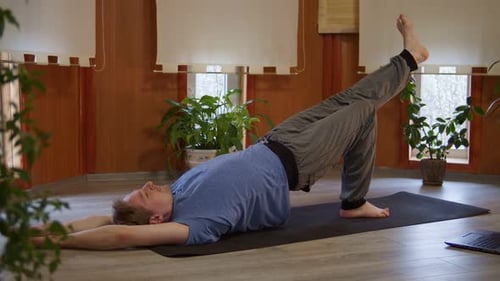Blonde Man Doing Yoga at Home