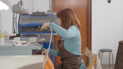 Freelance Artisan Making Pet Accessory In Workshop