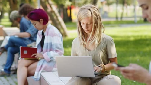 Students Using Technology in Urban Park Setting