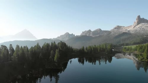 Aerial Flying over Mountain Lake Federa in Dolomites Alps Italy