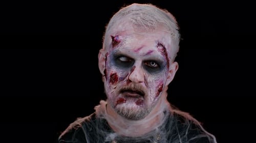 Man in Zombie Makeup Against Black Background