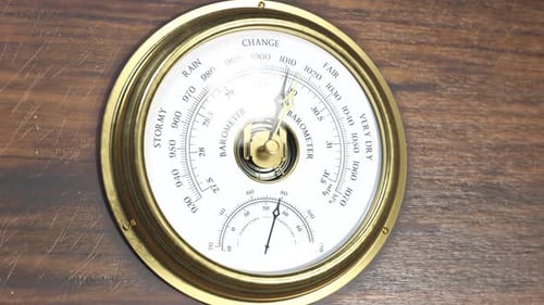 Vintage Brass Barometer and Thermometer Indicating Weather Changes