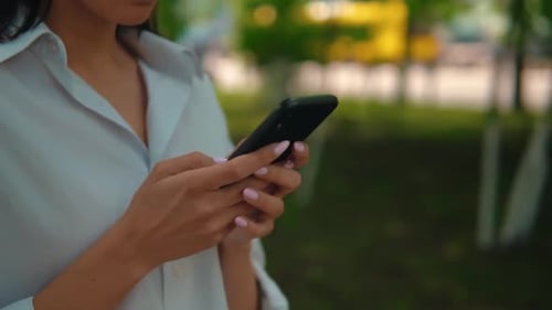 Close Up Female Hands Holding Mobile Outdoors