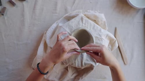 Potter Making Ceramic Bowl in Studio