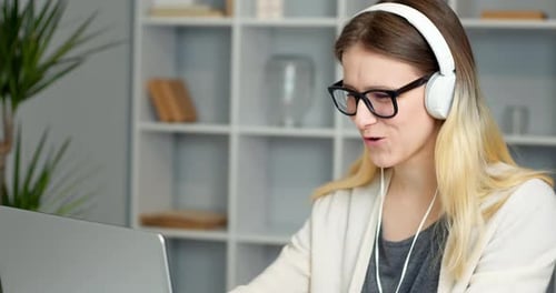 Woman Attending Video Call in Home Office