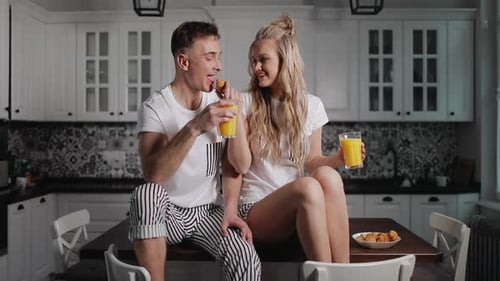 Couple Enjoys Breakfast Together in Bright Kitchen