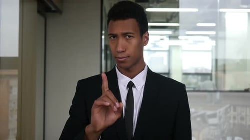 No, Not allowing Gesture by Waving Finger by Businessman