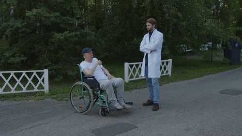 The Conversation of Old Man and Young Doctor the the Clinic's Park