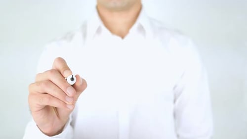 Person Writes 'Accredited' on Clear Surface