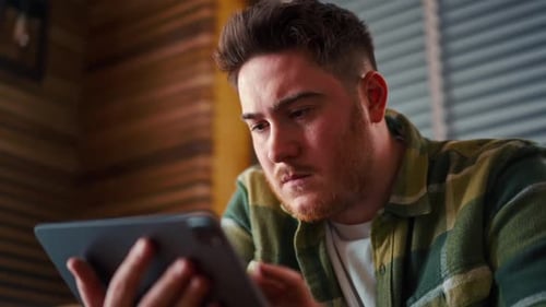 Man Using Tablet Device Technology Indoors