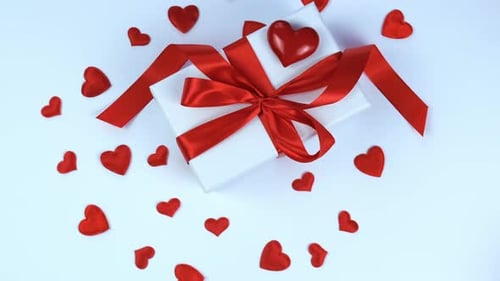 Gift Box with Red Ribbon and Heart Decoration