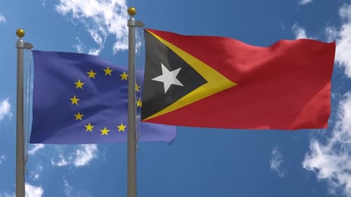 Flagge der Europäischen Union gegen Osttimor-Flagge am Fahnenmast