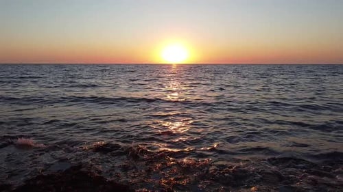 Shooting From a Drone Flying Over the Sea To the Sun Sunset in the Sea