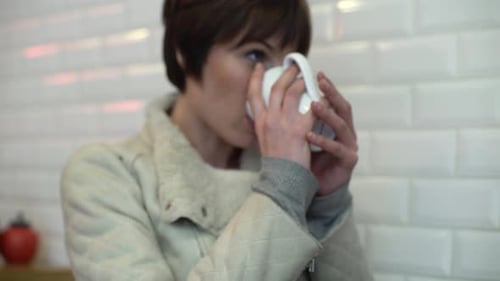 Woman drinking coffee in cafe