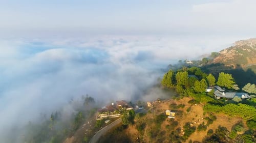 Scenic Aerial Nature Shot with Beautiful Clouds in the Golden Light of Sunrise