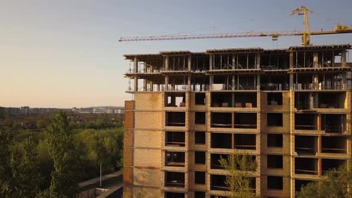Aerial view of tall residential apartment buildings under construction.