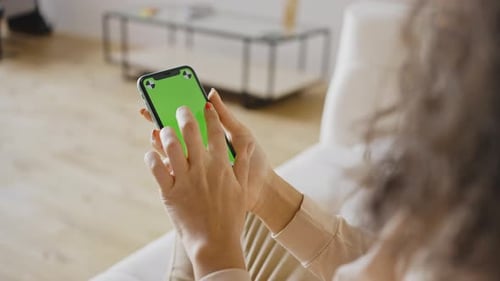 Close Up Woman Hands Holding Chromakey Green Screen Smartphone Watching Content Swiping Scrolling