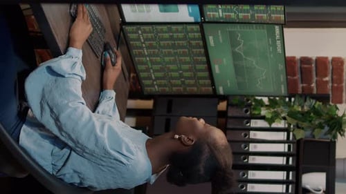 Vertical Video African American Woman Analyzing Stock Market Investment