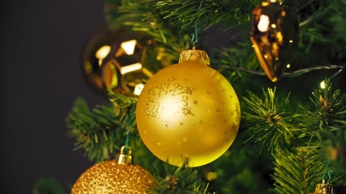 Golden Christmas Ornaments Decorate Tree for the Holidays