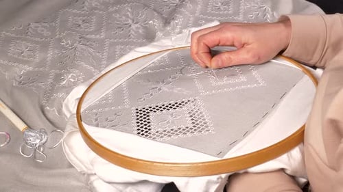 Woman's Hands Sewing Silver Pattern